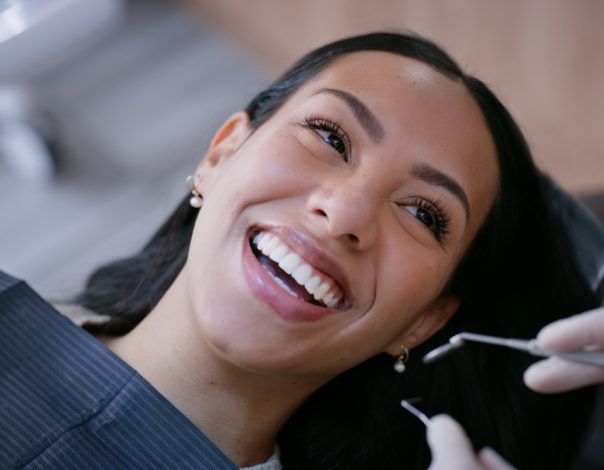 woman smiling at a dental appointment