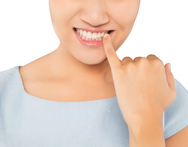 Person touching their teeth